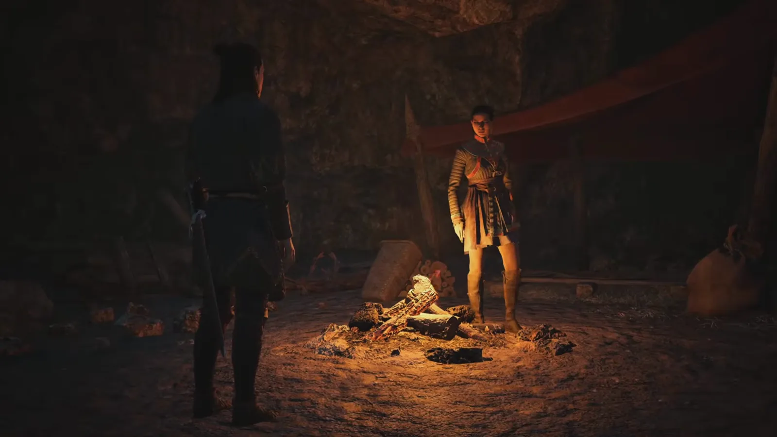 Coen standing before Lacra across a small campfire inside her stone Svartra hideout during her companion route in The Blood of Dawnwalker