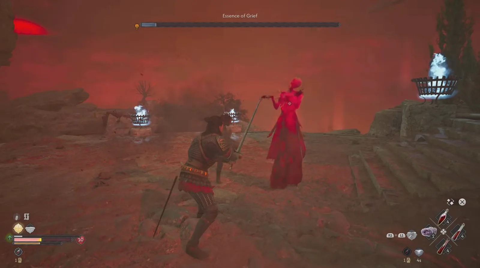 Full view of the Essence of Grief as a tall red-glowing woman in a tattered gown holding a slender blade on the steps of a ruined temple