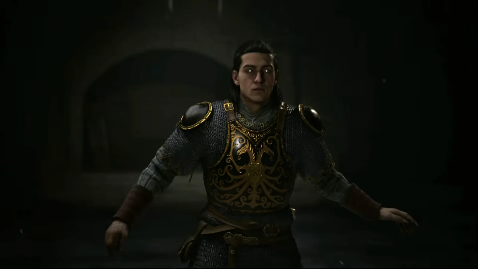 The Blood of Dawnwalker boss Mihai chained and kneeling inside a stone arched alcove in his crypt as Coen approaches before the boss fight begins