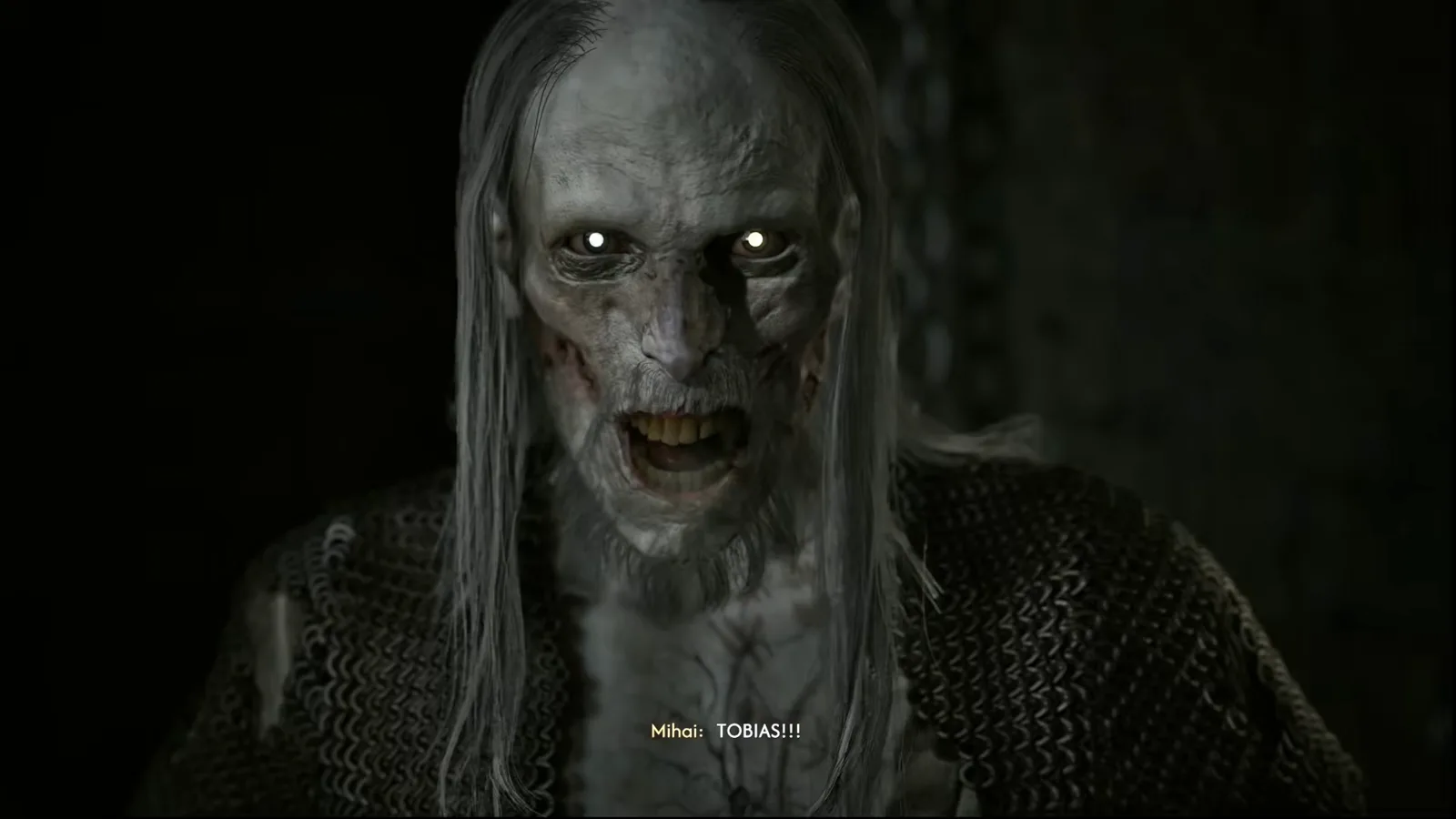 The Blood of Dawnwalker boss Mihai screaming the subtitle TOBIAS in his intro close-up, with ghastly pale skin, long white hair and glowing eyes inside the cathedral crypt